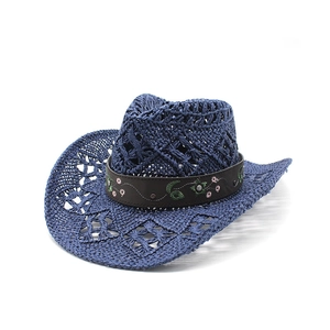 Navy blue hollow straw cowboy hat with embroidered floral band and wide curved brim