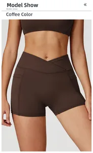 Close-up of high-waisted yoga shorts with crossover V-waistband and side pocket