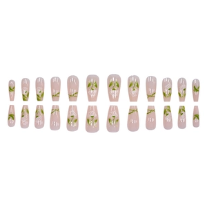 Green floral press-on nails set with daisy patterns on long coffin shaped tips
