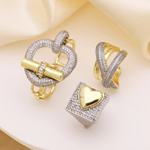 Exaggerated two-tone heart rings with cubic zirconia pavé and 18k gold plating