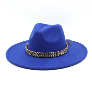 Close-up of Klein blue fedora hat with ethnic woven band and side knot detail