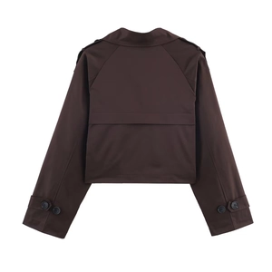 Rear view of short dark brown trench coat with storm flap and buckled cuffs