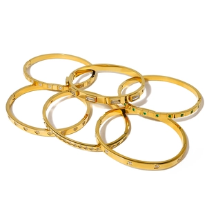 Set of six 18K gold plated geometric bracelets with zircon stones and green gems