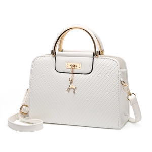 White structured handbag with V-shaped quilting, gold deer charm and metal handle
