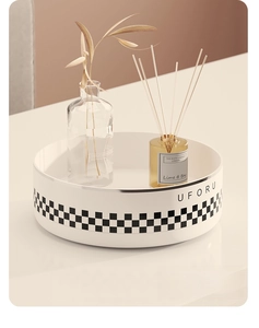 Rotating kitchen spice organizer with checkerboard trim showing aromatherapy storage