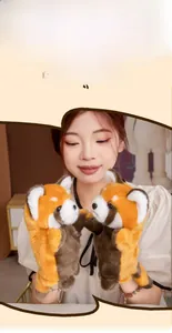 Detail showing plush red panda hand puppet gloves for winter warmth and play
