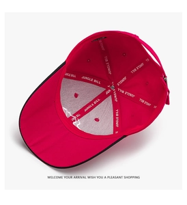 Detail view of red baseball cap interior featuring reinforced branding tape and metal buckle