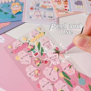 Close-up of cute cartoon rabbit PET stickers with glitter finish for scrapbooking