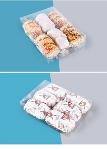 Macro shot of 6-slot clear plastic bakery box with sesame buns and branded paper liners
