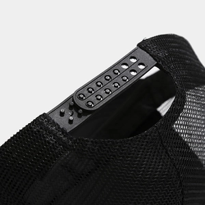 Detail of adjustable snapback closure on black mesh trucker hat with durable stitching