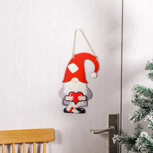 Christmas gnome wooden door hanger with red hat and heart on white door background