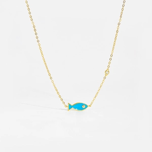 Detail of gold fish necklace with blue enamel pendant and sparkling zircon stone