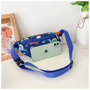 Blue kids dinosaur chest bag with adjustable strap shown next to phone for scale