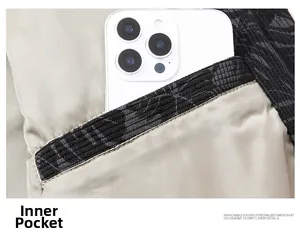 Detailed interior view of a stylish jacket showing a deep silk pocket holding a smartphone