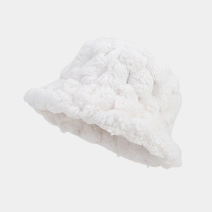 Close-up of white faux fur bucket hat featuring textured pineapple weave pattern