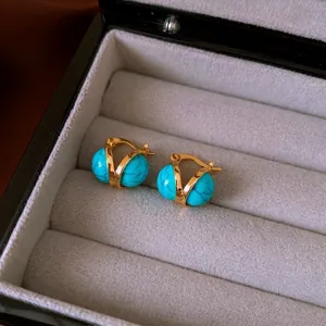 Vintage gold metal earrings with round turquoise resin beads and marble texture