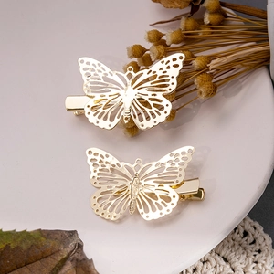 Barrettes papillon dorées élégantes avec design en métal creux et fini poli