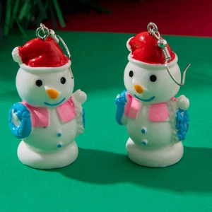 Detail of festive resin snowman earrings with red hat and pink scarf for Christmas