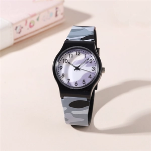 Close-up of camouflage silicone watch strap and classic dial with Arabic numerals
