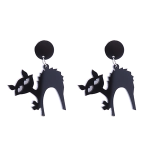 Macro detail of black acrylic black cat earrings for Halloween festival accessories