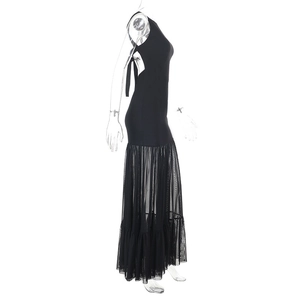 Detail view of black backless long dress with sheer mesh patchwork and lace-up design