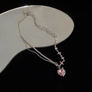 Double layer silver star necklace with pink heart crystal pendant on mirror background