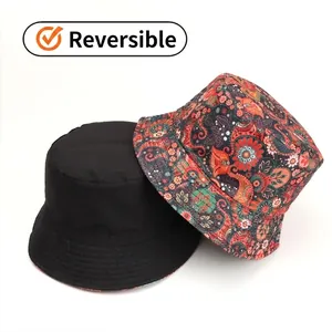Reversible bucket hat for women featuring solid black side and floral paisley pattern