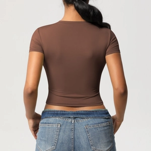 Close-up back view of brown tight-fit short sleeve yoga crop top for athletic wear