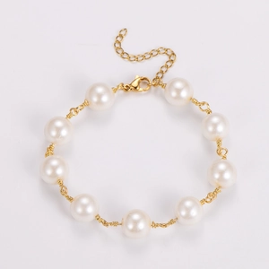 Detail of baroque pearl bracelet with gold wire wrapping and adjustable lobster clasp