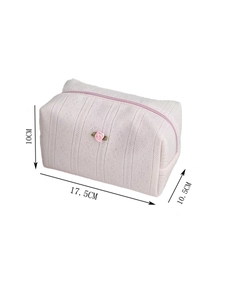 Detailed view of pink knitted cosmetic bag with 3D rose and size 17.5x10x10.5cm