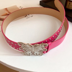 Detail of pink leather belt with silver hollow butterfly buckle and metallic rivets