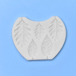 White silicone leaf mold featuring oak and veined leaves for fondant and clay crafts