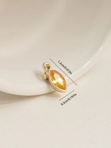 Detailed view of 18K gold plated marquise-cut yellow zircon pendant with dimensions
