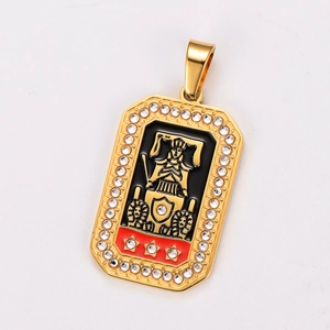 Detail of gold tarot chariot pendant with rhinestones and black relief pattern