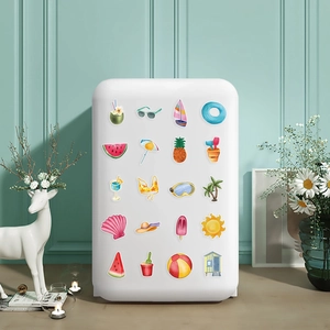 Various summer beach theme stickers displayed on a mini fridge in a home setting