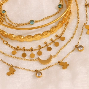 Gold bohemian layered bracelet set with moon, butterfly pendants and turquoise stones