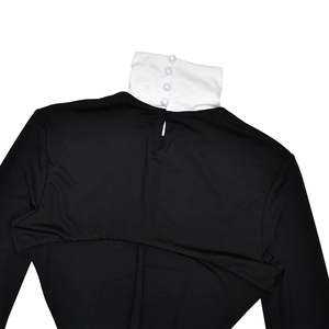 Detail of high collar with white fabric and four pearl buttons with back cutout