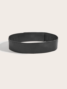 Detailed view of women's wide black leather belt with premium stitching for dresses