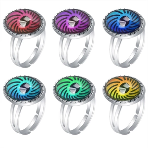 Detailed view of six adjustable mood rings featuring colorful oval stones in various shades