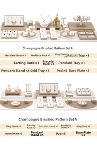 Detail view of champagne gold jewelry display set with necklace stands and ring holders