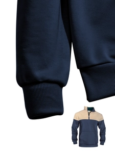 Detailed view of navy ribbed cuffs and half-zip collar on waffle knit sweater