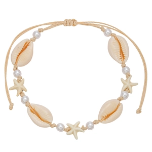 Bohemian woven starfish shell anklet with pearls on a professional white background
