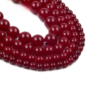 Close-up of red natural stone beads with detailed ice crackle and cotton wool texture