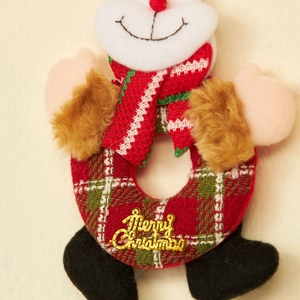 Christmas plush ornaments with reindeer and Santa designs and Merry Christmas signs