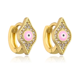 Macro shot of 18K gold plated evil eye earrings with pink enamel and clear zircon stones