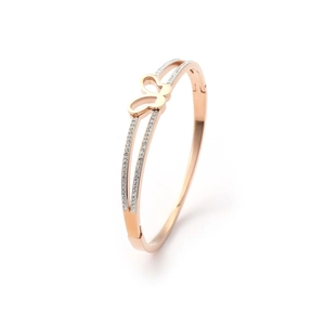 Detail of rose gold butterfly bangle with elegant double-track design and white zircon inlay