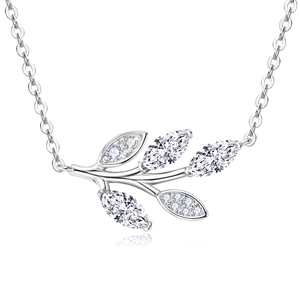 Macro shot of silver leaf pendant necklace with marquise and round cut moissanite stones