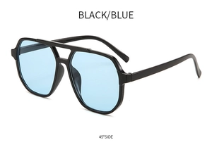 Detail of oversized double-bridge aviator sunglasses with black frame and blue lenses
