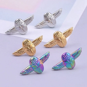 Detailed view of 304 stainless steel winged beetle earrings in rainbow and metallic finishes