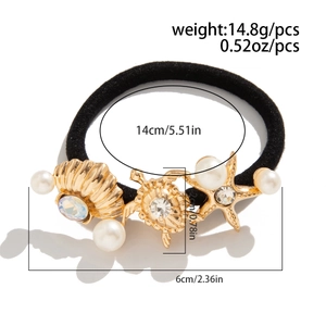 Detail showing weight and size measurements of the seashell pearl ponytail holder